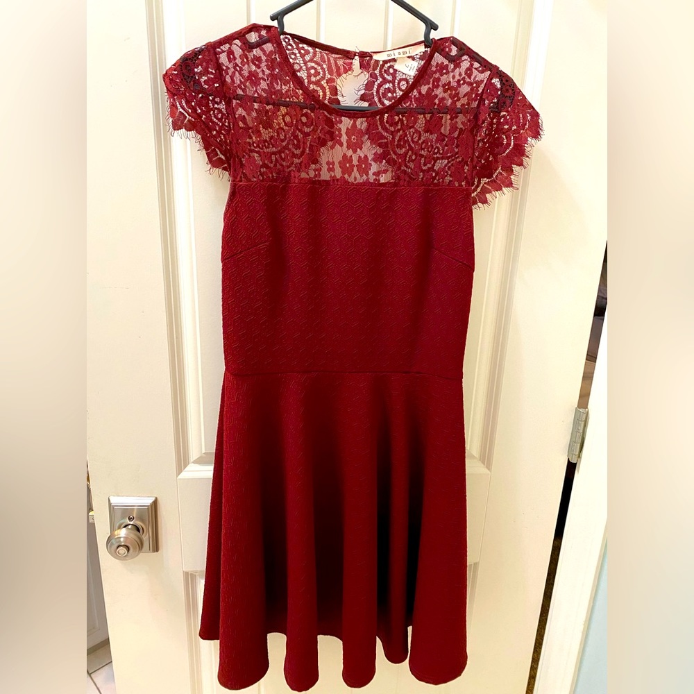 Large, lace red women’s dress